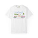White t-shirt featuring a hand-painted illustration of the Pineapple Fountain in Charleston, SC surrounded by palm trees and colorful flowers, created by Rebecca Illustrated.
