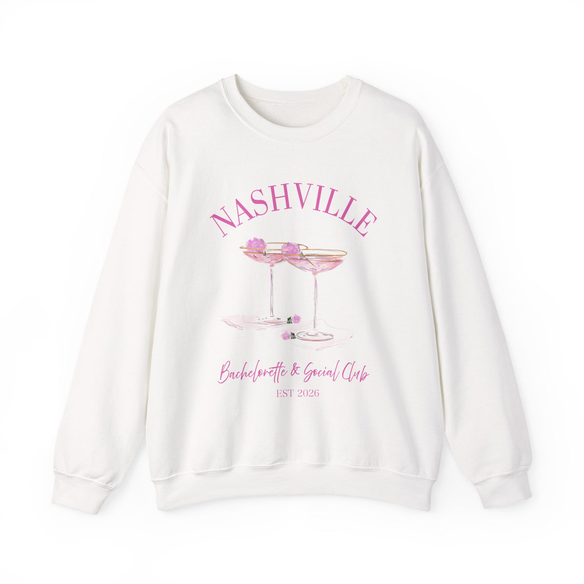 White crewneck sweatshirt with pink ‘Nashville’ bachelorette social club artwork featuring champagne coupe illustration, hand designed by Rebecca Illustrated