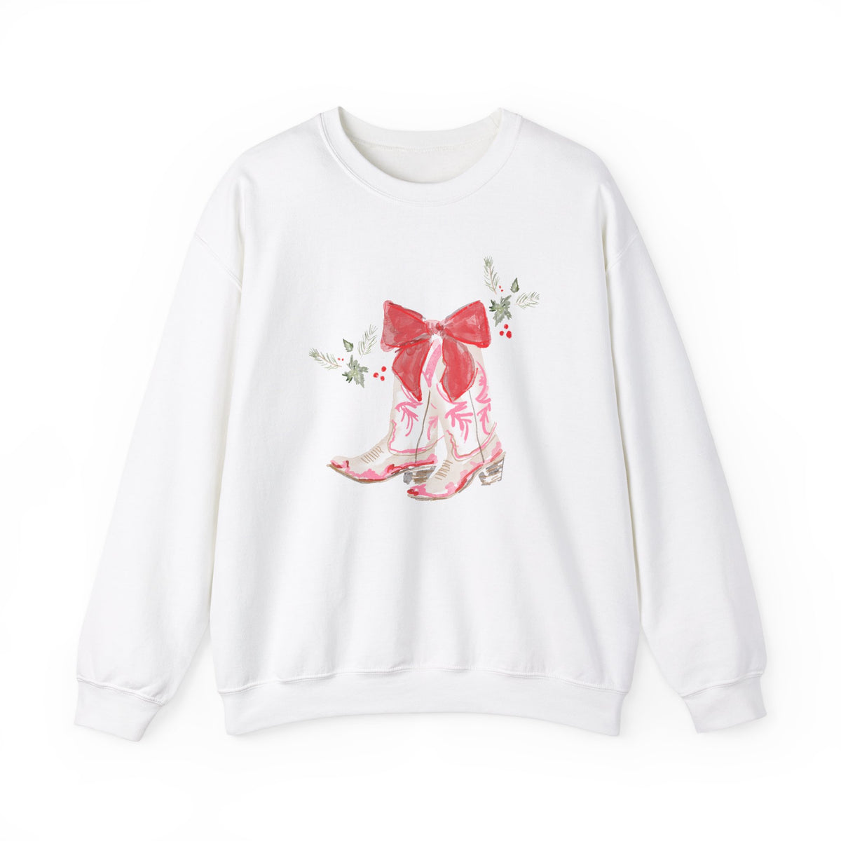 White sweatshirt with illustrated pink cowgirl boots tied with a red holiday bow and greenery accents, artwork by Rebecca Illustrated