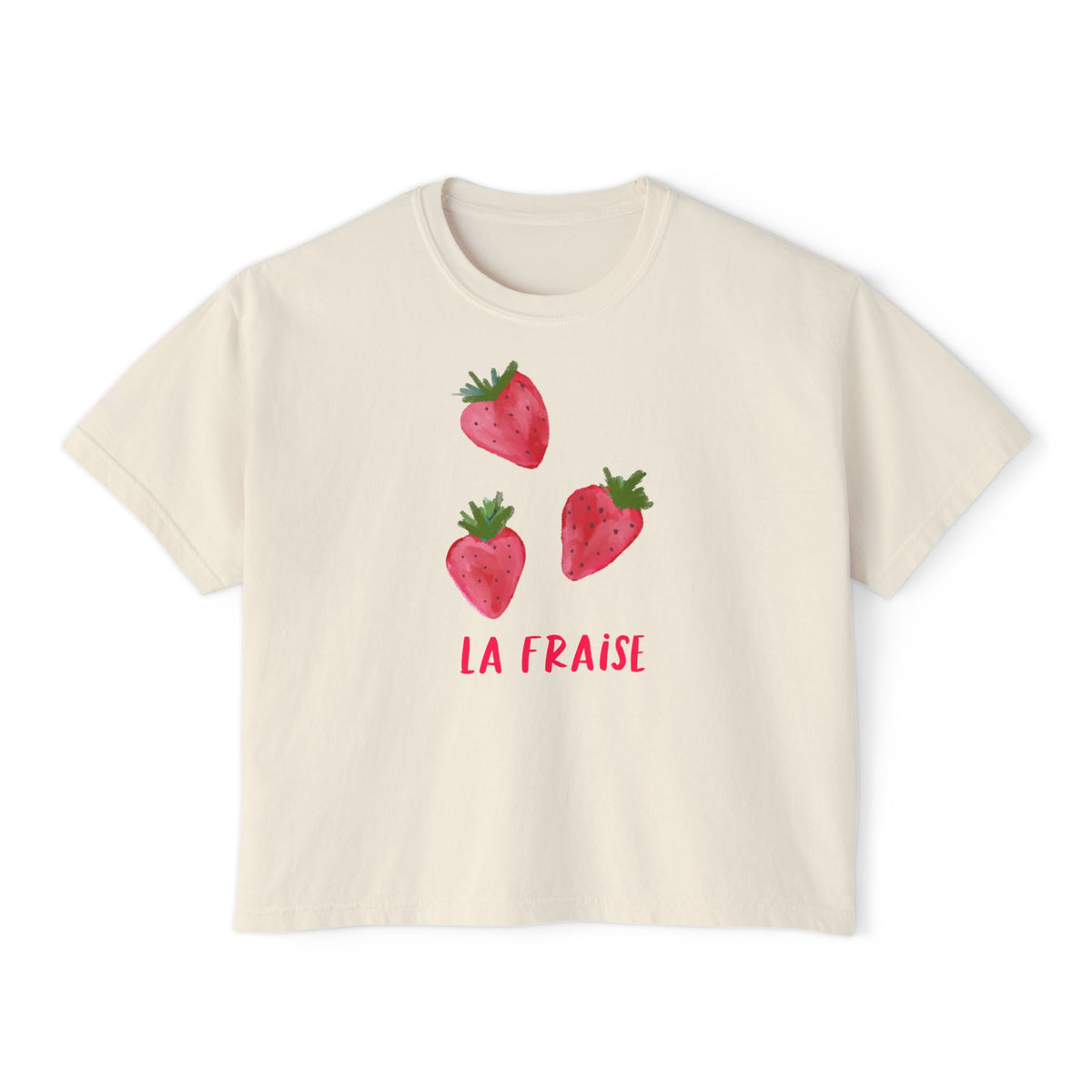 Cream cropped t-shirt featuring three hand-drawn strawberries and the text ‘La Fraise’ in pink lettering, illustrated by Rebecca Illustrated.