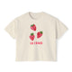Cream cropped t-shirt featuring three hand-drawn strawberries and the text ‘La Fraise’ in pink lettering, illustrated by Rebecca Illustrated.