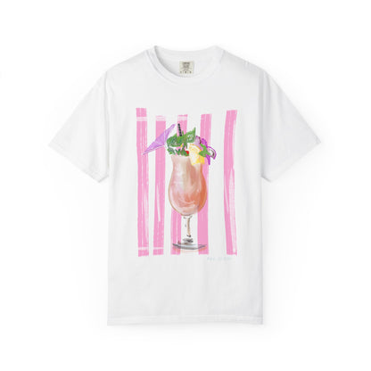 White t-shirt with Rebecca Illustrated watercolor pink tropical cocktail daiquiri artwork featuring umbrella, citrus, flowers, and pink brushstroke background