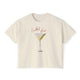 Cream t-shirt featuring a hand-drawn martini cocktail with olives and the words “Cocktail Hour,” illustrated by artist Rebecca Illustrated