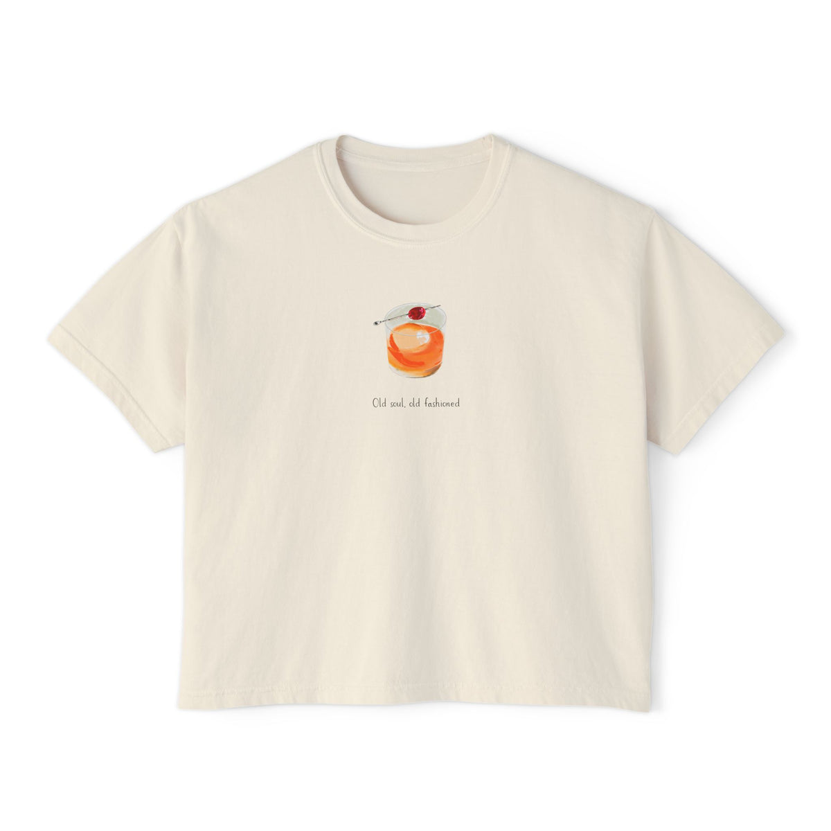 Cream cropped t-shirt featuring a hand-painted Old Fashioned cocktail with a cherry garnish and the text ‘Old soul, old fashioned,’ illustrated by Rebecca Illustrated."