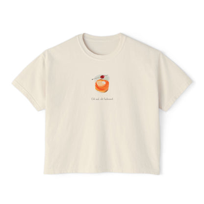 Cream cropped t-shirt featuring a hand-painted Old Fashioned cocktail with a cherry garnish and the text ‘Old soul, old fashioned,’ illustrated by Rebecca Illustrated."