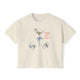 Cream cropped t-shirt featuring a hand-drawn dirty martini with olives, seashells, a bow on the stem, and the text ‘Tini Bit Salty’ by Rebecca Illustrated