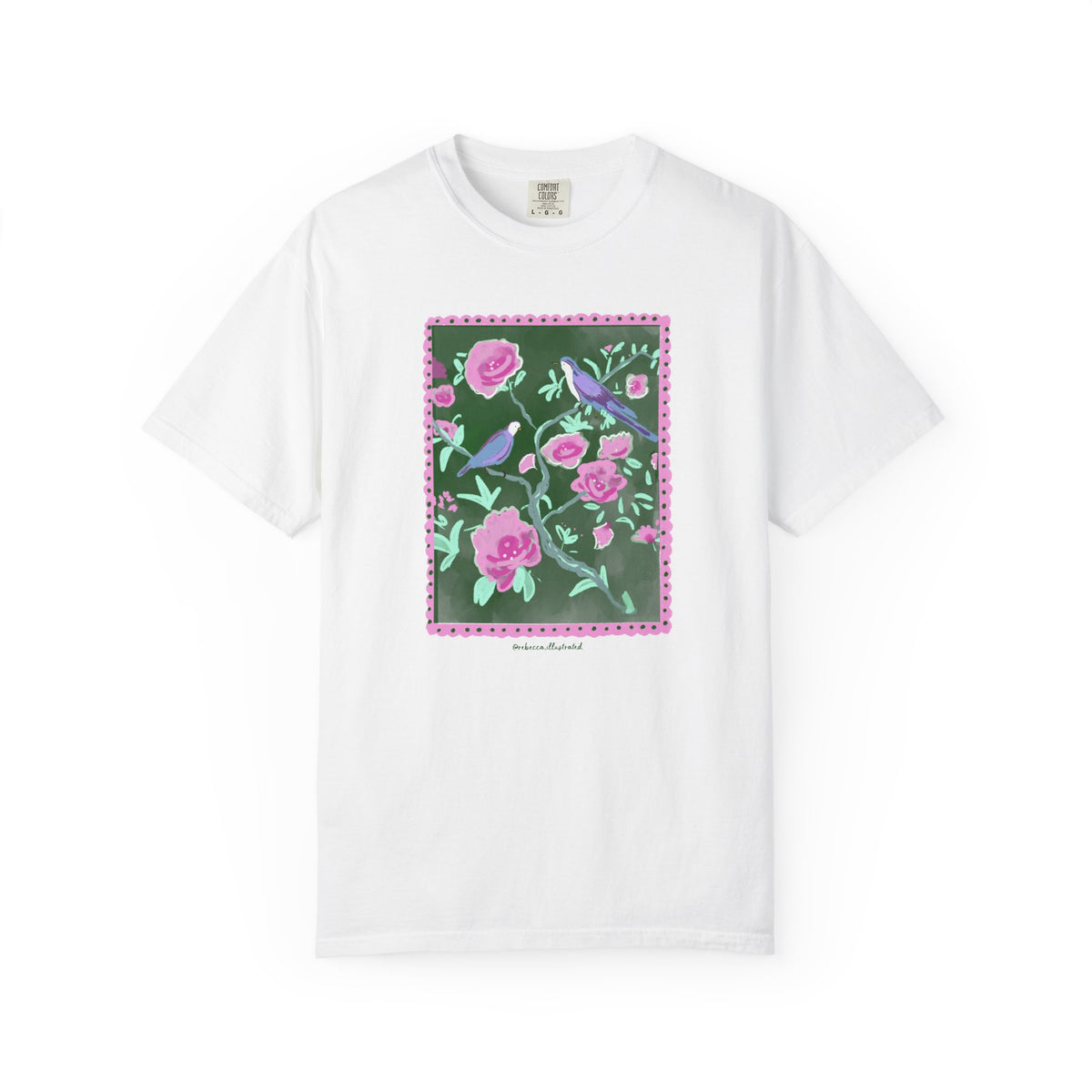 White t-shirt with a floral and bird design on a white background