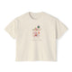 Cream cropped t-shirt featuring a hand-painted bar cart with cocktails, flowers, glassware, and the text ‘Cocktail Hour is a Lifestyle,’ illustrated by Rebecca Illustrated.