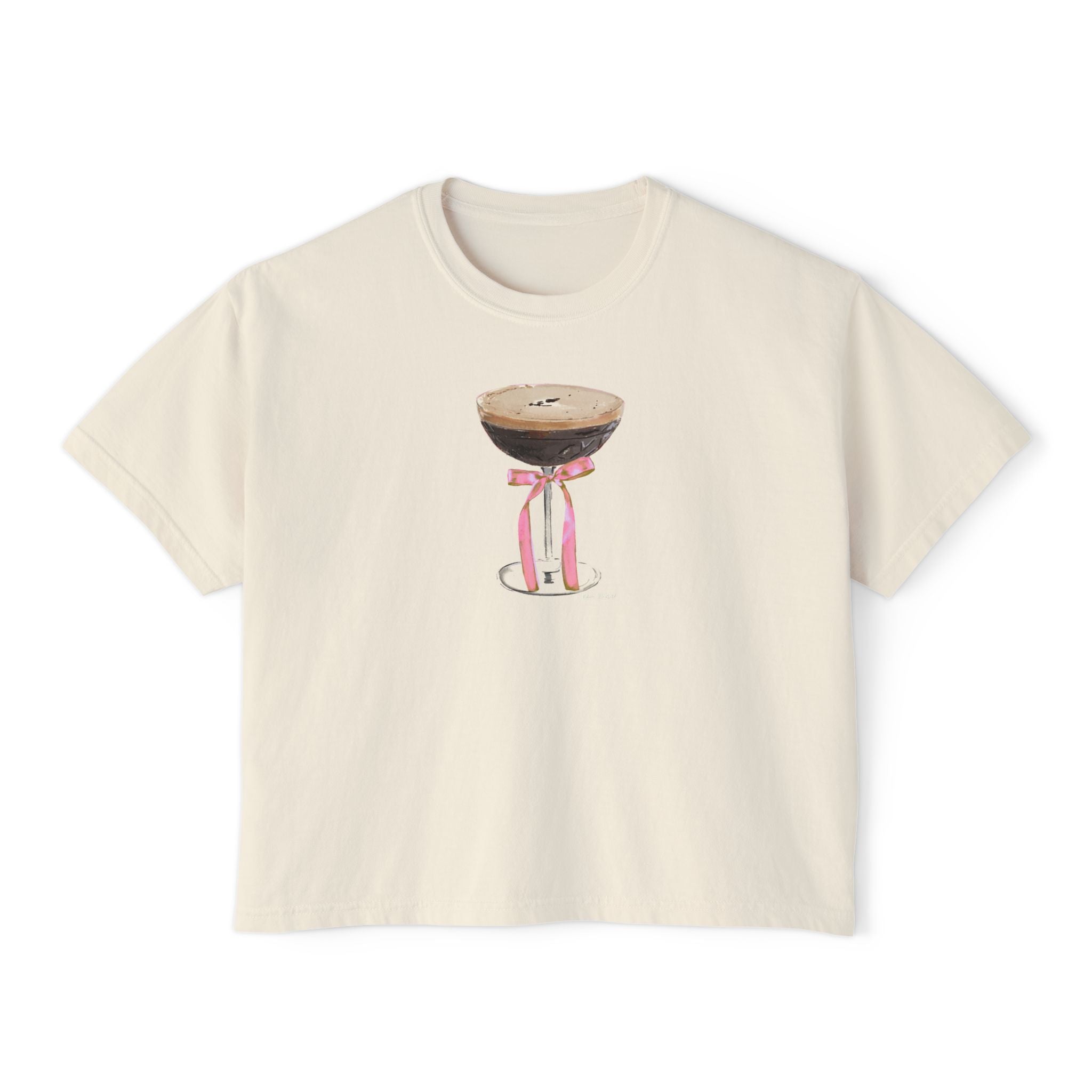 Cream cropped t-shirt featuring a hand-drawn espresso martini glass with a pink ribbon illustration by Rebecca Illustrated.