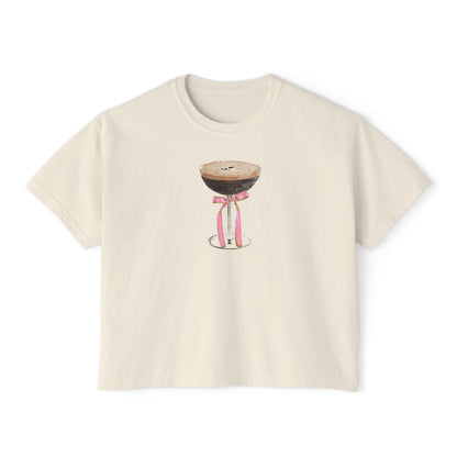 Cream cropped t-shirt featuring a hand-drawn espresso martini glass with a pink ribbon illustration by Rebecca Illustrated.