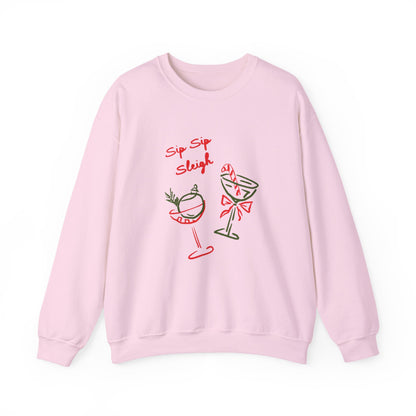 crewneck sweatshirt with ‘Sip Sip Sleigh’ holiday cocktail artwork in red and green, hand illustrated by Rebecca Illustrated