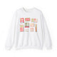 White sweatshirt with illustrated vintage-style matchbooks featuring Charleston themes, restaurants, palm tree, girl illustration, and pastel colors, artwork by Rebecca Illustrated