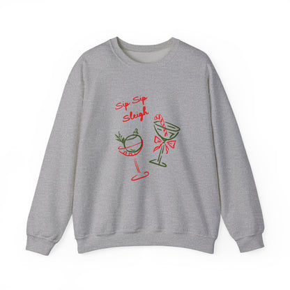 crewneck sweatshirt with ‘Sip Sip Sleigh’ holiday cocktail artwork in red and green, hand illustrated by Rebecca Illustrated