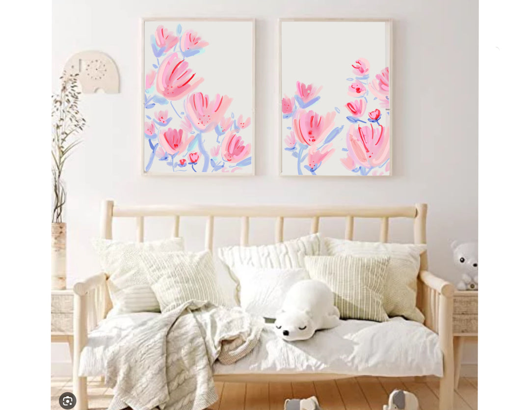 Two-piece pink and blue abstract floral diptych art print set in light wood frames against a white background.
