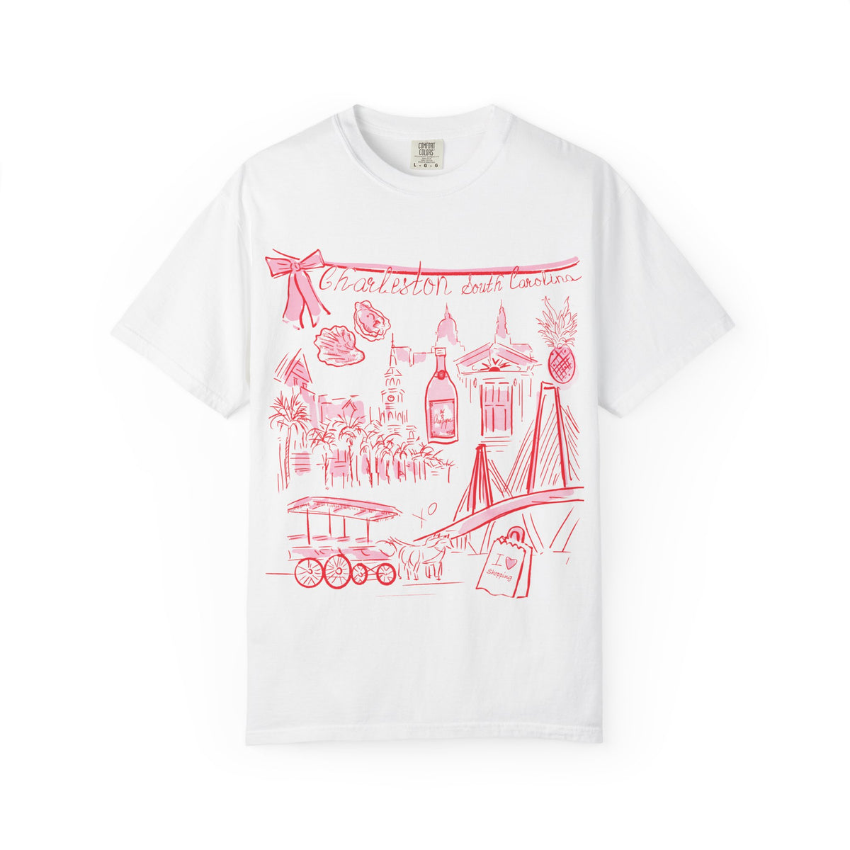 White graphic t-shirt featuring a hand-drawn coral pink illustration of Charleston, South Carolina landmarks including the Ravenel Bridge, historic buildings, church steeples, palm trees, oysters, pineapple, horse-drawn carriage, and Charleston-themed icons.