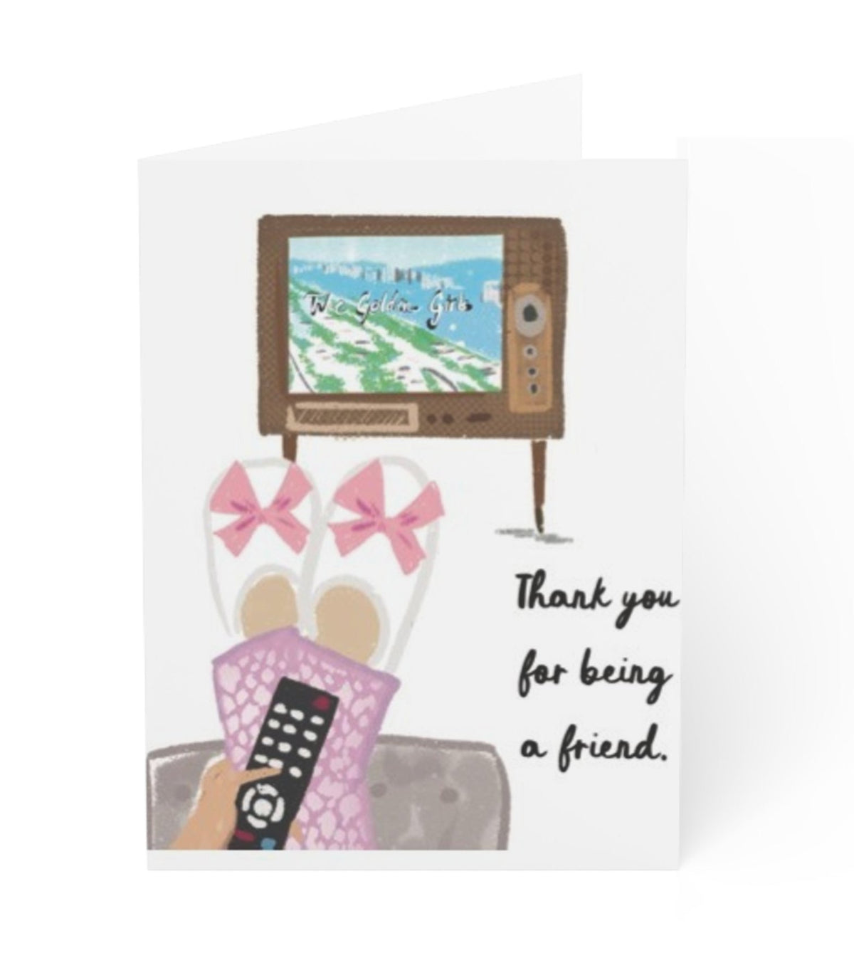 Friendship greeting card with illustrated cozy scene featuring slippers, a TV remote, and the words “Thank you for being a friend,” blank interior