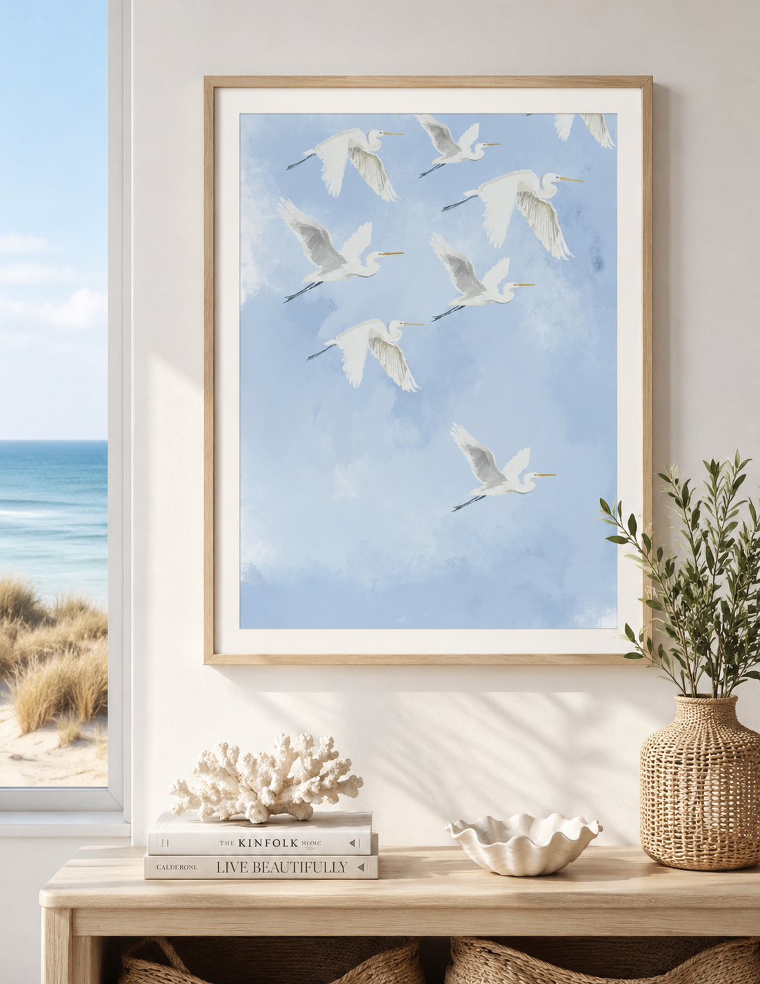 Framed artwork of birds flying against a blue sky in a home setting.