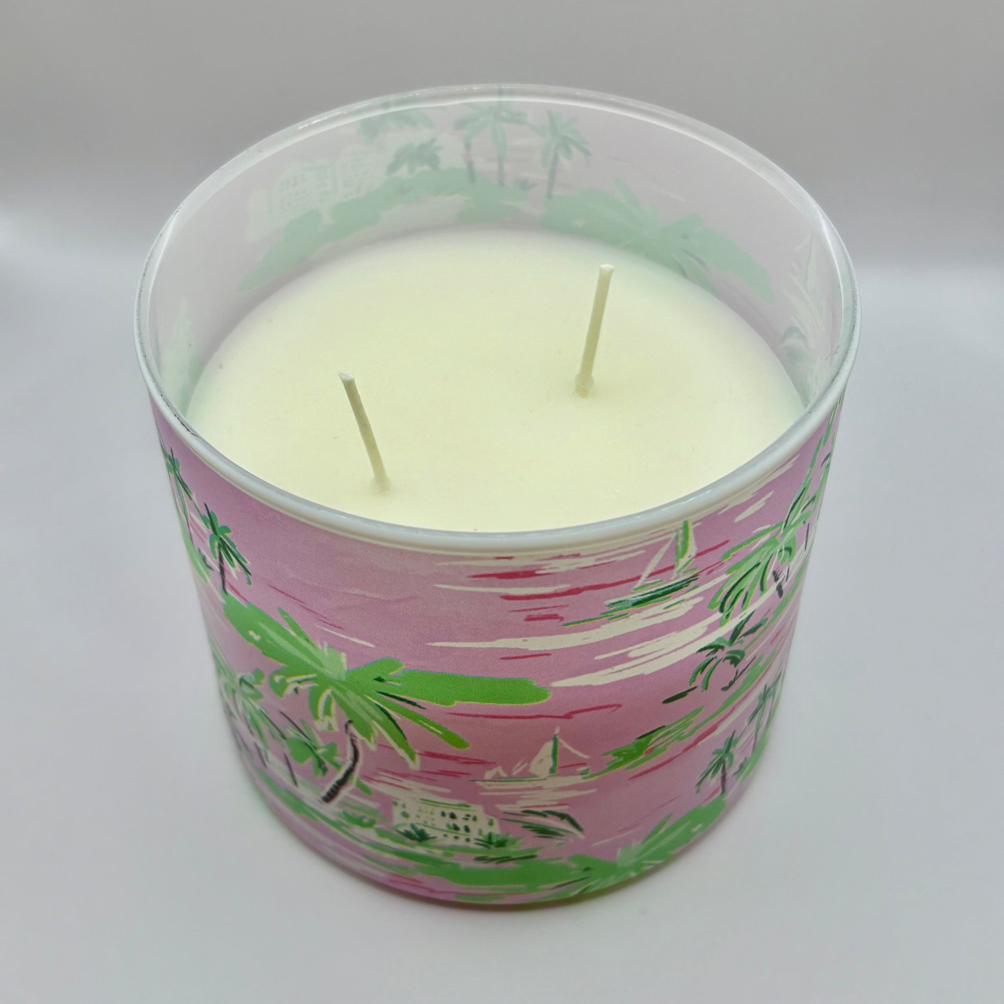 Hand illustrated pink coastal ceramic candle with palm trees and sailboats by Rebecca Illustrated