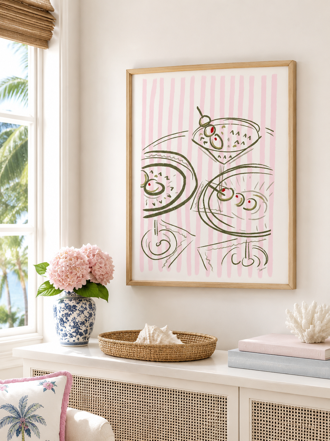 Framed artwork with abstract design on a wall in a room with decor elements.