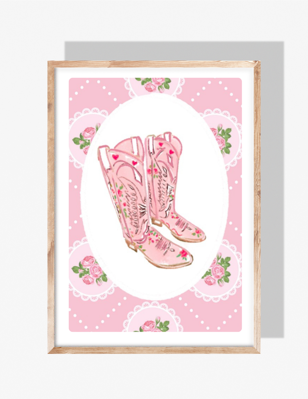 A whimsical illustration by Rebecca Illustrated of pink floral cowboy boots on a vintage-style pink patterned background with roses and lace details.