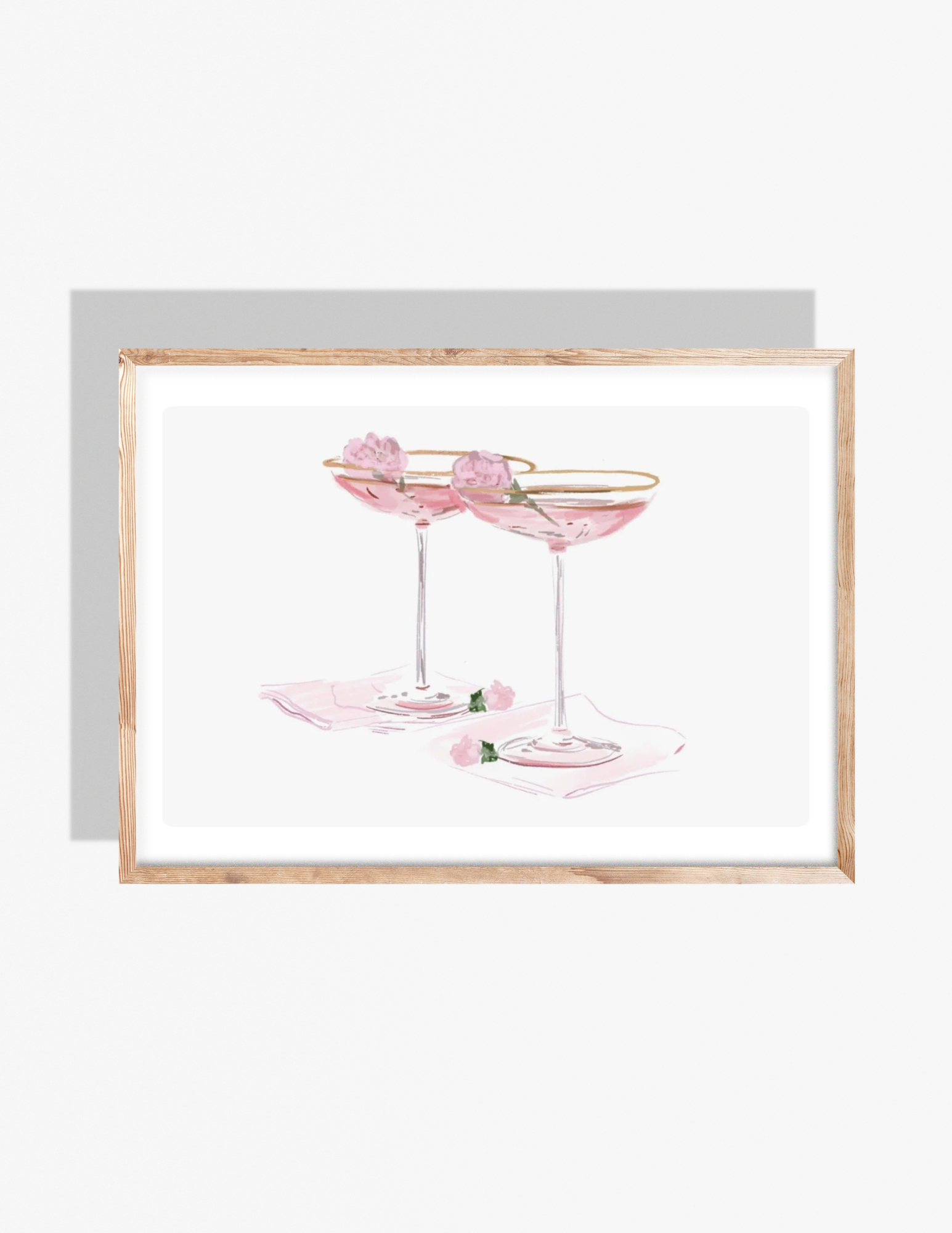 A soft pastel illustration by Rebecca Illustrated of two pink champagne coupe glasses with gold rims, each garnished with a small pink flower, resting on light pink napkins.