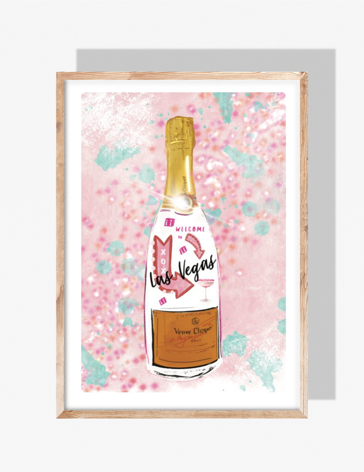 A pink and teal glitter-style illustration by Rebecca Illustrated featuring a champagne bottle decorated with the Las Vegas sign, dice, arrows, and celebratory accents.