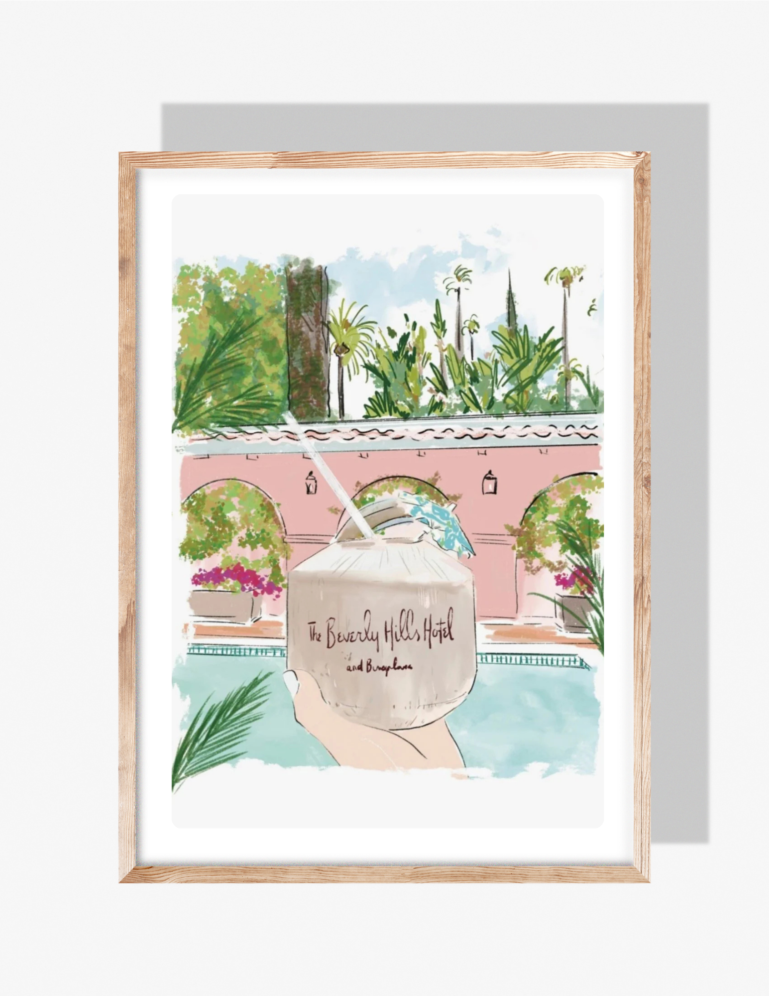 Illustration of a hand holding a Beverly Hills Hotel coconut drink beside a pink poolside backdrop with lush greenery, artwork by Rebecca Illustrated.