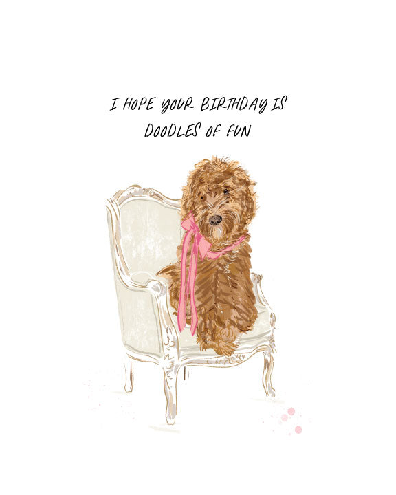 Birthday greeting card with an illustrated doodle dog sitting on a vintage chair and the text “I hope your birthday is doodles of fun,” blank interior