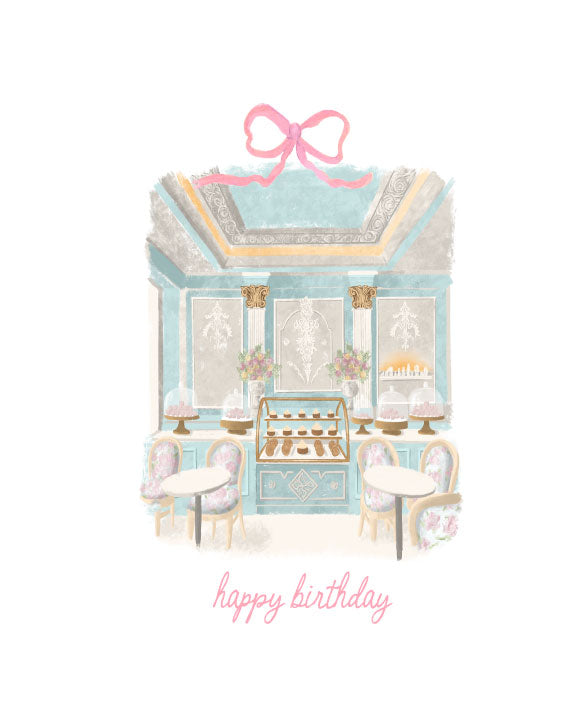 Illustrated birthday greeting card featuring a pastel blue French bakery interior with desserts, café tables, a pink bow, and “happy birthday” text, by Rebecca Illustrated.