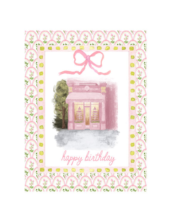 Illustrated birthday greeting card featuring a pink Parisian bakery storefront with patterned border and “happy birthday” text, by Rebecca Illustrated.