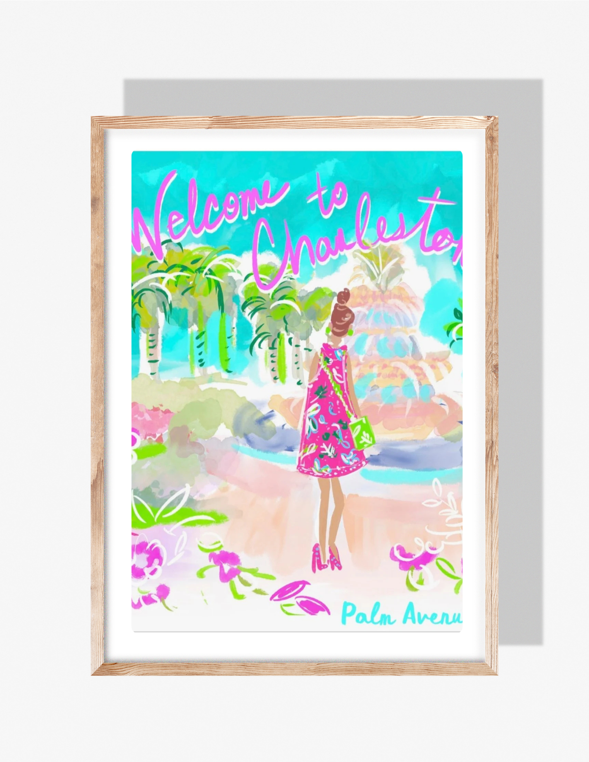 Colorful Charleston art print by Rebecca Illustrated featuring a fashionably dressed woman in a bright pink dress overlooking the Pineapple Fountain with the text “Welcome to Charleston.”