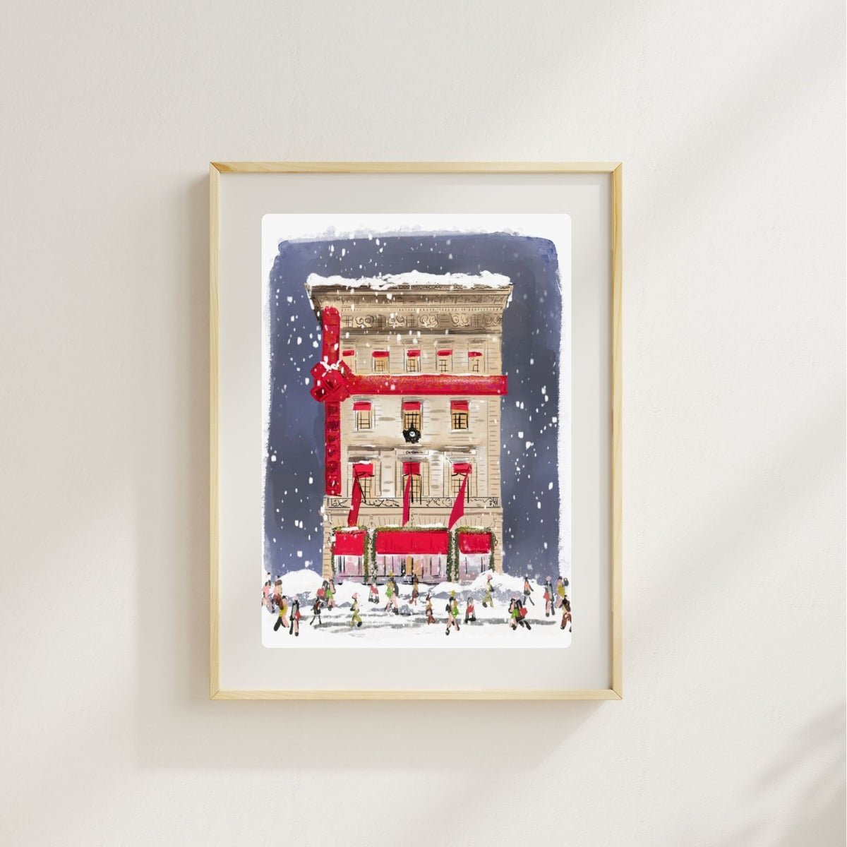 Illustration of a New York City building wrapped in a red ribbon with snow falling and people walking below, festive Manhattan holiday artwork.