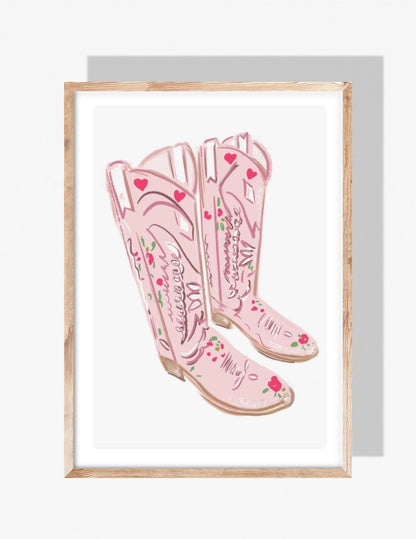 Illustration of pastel pink cowgirl boots decorated with hearts and floral details — art print by Rebecca Illustrated.
